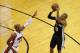 Jun 10, 2014; Miami, FL, USA; San Antonio Spurs guard Patty Mills (8) shoots while defended by Miami Heat guard Ray Allen (34) during the third quarter of game three of the 2014 NBA Finals at American Airlines Arena. Mandatory Credit: Robert Mayer-USA TODAY Sports