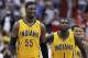 Indiana Pacers center Roy Hibbert (55) smiles as he walks across the court with Indiana Pacers guard Lance Stephenson (1) in the closing minutes of the second half of Game 4 of an Eastern Conference semifinal NBA basketball playoff game in Washington, Sunday, May 11, 2014. The Pacers won 95-92. (AP Photo/Alex Brandon)