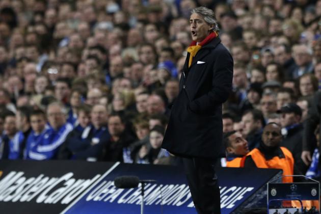 Galatasaray's head coach Roberto Mancini watches his side from the technical area during the Champions League last 16 second leg soccer match between Chelsea and Galatasaray at Stamford Bridge stadium in London, Tuesday, March 18, 2014. (AP Photo/Matt Dunham)