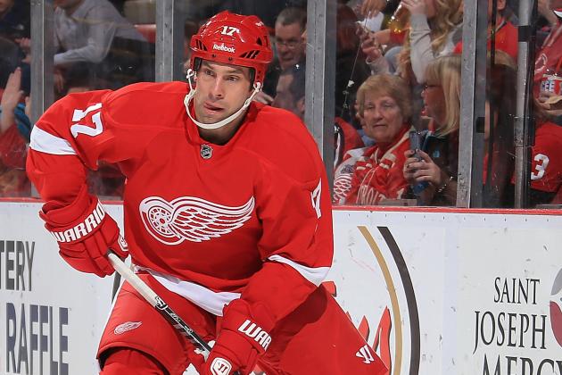 DETROIT, MI - MARCH 7: David Legwand #17 of the Detroit Red Wings looks to pass the puck against the New Jersey Devils during an NHL game on March 7, 2014 at Joe Louis Arena in Detroit, Michigan. Detroit defeated New Jersey 7-4. (Photo by Dave Reginek/NHLI via Getty Images)