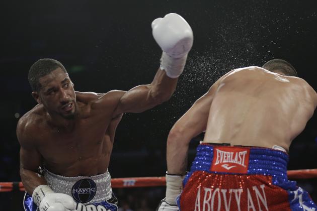 Demetrius Andrade, left hits Vanes Martirosyan, right during round 4 of a WBO junior middleweight title bout, Saturday, Nov. 9, 2013, in Corpus Christi, Texas. (AP Photo/Eric Gay)