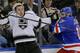 Los Angeles Kings left wing Tanner Pearson (70), left, crashes the boards with New York Rangers defenseman John Moore (17) in the third period during Game 4 of the NHL hockey Stanley Cup Final, Wednesday, June 11, 2014, in New York. (AP Photo/Frank Franklin II)