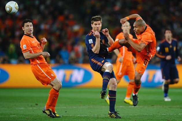 JOHANNESBURG, SOUTH AFRICA - JULY 11: Nigel De Jong of the Netherlands tackles Xabi Alonso of Spain with a kick in the chest during the 2010 FIFA World Cup South Africa Final match between Netherlands and Spain at Soccer City Stadium on July 11, 2010 in Johannesburg, South Africa. (Photo by Laurence Griffiths/Getty Images)