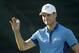 Martin Kaymer, of Germany, waves after shooting 65 in the first round of the U.S. Open golf tournament in Pinehurst, N.C., Thursday, June 12, 2014. (AP Photo/David Goldman)