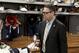 Buffalo Sabres general manager Tim Murray exits the Sabres locker room after players gathered for the last time on Monday, April 14, 2014, in Buffalo, N.Y. (AP Photo/Nick LoVerde)