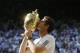 Andy Murray of Britain poses with the trophy after defeating Novak Djokovic of Serbia during the Men's singles final match at the All England Lawn Tennis Championships in Wimbledon, London, Sunday, July 7, 2013. (AP Photo/Kirsty Wigglesworth)