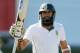 PORT ELIZABETH, SOUTH AFRICA - FEBRUARY 22: Hashim Amla of South Africa celebrates reaching 50 runs during day three of the Second Test match between South Africa and Australia at AXXESS St George's Cricket Stadium on February 22, 2014 in Port Elizabeth, South Africa. (Photo by Morne de Klerk/Getty Images)