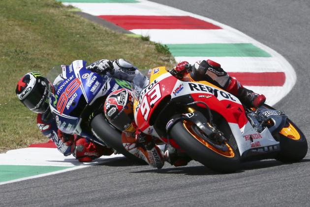 Honda rider Marc Marquez, right, of Spain, and Yamaha rider Jorge Lorenzo, of Spain, challenge for first place during the Italian Moto GP, at the Mugello race circuit, in Scarperia, Italy, Sunday, June 1, 2014. (AP Photo/Antonio Calanni)