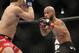 Demetrious Johnson, right, and Joseph Benavidez battle for the UFC Flyweight Mixed Martial Arts title in Sacramento, Calif., on Saturday, Dec. 14, 2013.(AP Photo/Steve Yeater)
