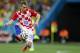 Croatia's Luka Modric controls the ball during the group A World Cup soccer match against Brazil in the opening game of the tournament, at Itaquerao Stadium in Sao Paulo, Brazil, Thursday, June 12, 2014. Brazil won 3-1. (AP Photo/Frank Augstein)