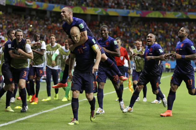 Netherlands' Arjen Robben celebrates with his teammates after scoring his side's fifth goal during the second half of the group B World Cup soccer match between Spain and the Netherlands at the Arena Ponte Nova in Salvador, Brazil, Friday, June 13, 2014. (AP Photo/Natacha Pisarenko)
