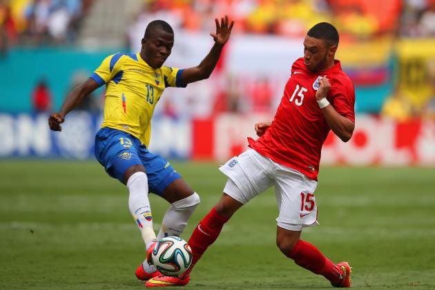 MIAMI GARDENS, FL - JUNE 04: Enner Valencia of Ecuador tackles Alex Oxlade-Chamberlain of England during the International friendly match between England and Ecuador at Sun Life Stadium on June 4, 2014 in Miami Gardens, Florida. (Photo by Richard Heathcote/Getty Images)