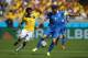 BELO HORIZONTE, BRAZIL - JUNE 14: Konstantinos Katsouranis of Greece controls the ball against Juan Guillermo Cuadrado of Colombia during the 2014 FIFA World Cup Brazil Group C match between Colombia and Greece at Estadio Mineirao on June 14, 2014 in Belo Horizonte, Brazil. (Photo by Paul Gilham/Getty Images)