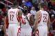 Jan 16, 2014; Houston, TX, USA; Houston Rockets shooting guard James Harden (13) speaks with power forward Dwight Howard (12) and small forward Chandler Parsons (25) during the first quarter against the Oklahoma City Thunder at Toyota Center. Mandatory Credit: Andrew Richardson-USA TODAY Sports