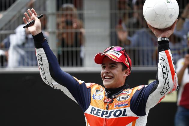 MotoGP raider Marc Marquez of Spain celebrates after wining the Catalunya Motorcycle Grand Prix at the Barcelona Catalunya racetrack in Montmelo, near Barcelona, Spain, on Sunday, June 15, 2014. (AP Photo/Andres Kudacki)