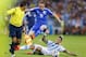 Bosnia's Edin Visca (19) leaps over Argentina's Marcos Rojo (16) as he chases the ball during the group F World Cup soccer match between Argentina and Bosnia at the Maracana Stadium in Rio de Janeiro, Brazil, Sunday, June 15, 2014. (AP Photo/Kirsty Wigglesworth)