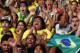 In this Thursday, June 12, 2014 photo, Brazilians celebrate after their team scores a goal against Croatia in the 2014 soccer World Cup opening game at a Fan Fest complex in Recife, Brazil. With Brazil struggling and down a goal against a spirited Croatian team, Neymar came through to lead his team to a 3-1 win in the opening match, scoring once in each half. (AP Photo/Dolores Ochoa)