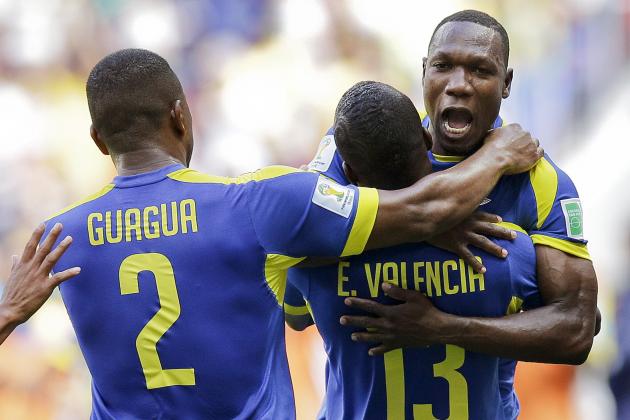 Ecaudor players celebrate after Enner Valencia, center, scored the opening goal during the group E World Cup soccer match between Switzerland and Ecuador at the Estadio Nacional in Brasilia, Brazil, Sunday, June 15, 2014. (AP Photo/Michael Sohn)