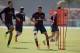 England national soccer team player Alex Oxlade-Chamberlain, center, who is recovering from a knee injury, takes part in a drill beside Chris Smalling, left, during a squad training session for the 2014 soccer World Cup at the Urca military base in Rio de Janeiro, Brazil, Monday, June 16, 2014. (AP Photo/Matt Dunham)