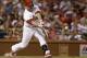 St. Louis Cardinals' Matt Holliday hits an RBI single, the 1000th RBI of his career, to score Jon Jay during the fifth inning of a baseball game against the New York Mets, Monday, June 16, 2014, in St. Louis. (AP Photo/Jeff Roberson)