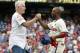 Philadelphia Phillies' Jimmy Rollins, right, celebrates his single with former Phillies' Mike Schmidt, left, during the fifth inning of a baseball game against the Chicago Cubs, Saturday, June 14, 2014, in Philadelphia. This single gives Jimmy Rollins the all time hits mark for the Philadelphia Phillies over Mike Schmidt. (AP Photo/Chris Szagola)