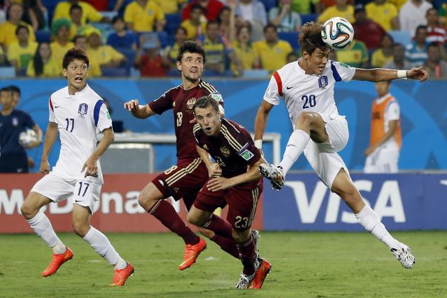 South Korea's Hong Jeong-ho, right, takes a shot during the group H World Cup soccer match between Russia and South Korea at the Arena Pantanal in Cuiaba, Brazil, Tuesday, June 17, 2014. (AP Photo/Kirsty Wigglesworth)