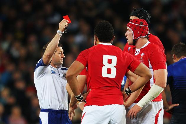 AUCKLAND, NEW ZEALAND - OCTOBER 15:  Wales captain Sam Warburton (hidden) receives a straight red card from Referee Alain Rolland of Ireland (L) for a dangerous tackle on Wing Vincent Clerc of France during semi final one of the 2011 IRB Rugby World Cup between Wales and France at Eden Park on October 15, 2011 in Auckland, New Zealand.  (Photo by David Rogers/Getty Images)