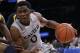 Xavier's Semaj Christon (0) protects the ball from Marquette's Jamil Wilson during the second half of an NCAA college basketball game in the quarterfinals of the Big East men's tournament Thursday, March 13, 2014, at Madison Square Garden in New York. Xavier won 68-65. (AP Photo/Frank Franklin II)