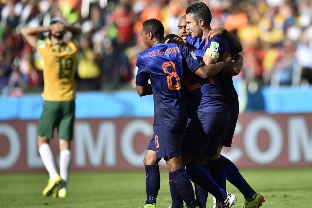 Dutch players celebrate after Netherlands' Memphis Depay scored his side's third goal during the group B World Cup soccer match between Australia and the Netherlands at the Estadio Beira-Rio in Porto Alegre, Brazil, Wednesday, June 18, 2014.   (AP Photo/Martin Meissner)