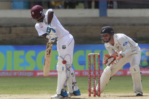 West Indies debutante  batsman Jermaine Blackwood, left, bats on his way to score a half century as New Zealand's wicket keeper BJ Watling, right, look on during the third day on their second cricket Test match in Port of Spain, Trinidad, Wednesday, June 18, 2014. (AP Photo/Arnulfo Franco)