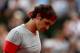 PARIS, FRANCE - JUNE 01: Roger Federer of Switzerland reacts during his men's singles match against Ernests Gulbis of Latvia on day eight of the French Open at Roland Garros on June 1, 2014 in Paris, France. (Photo by Matthew Stockman/Getty Images)