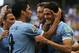 Uruguay's Luis Suarez, left, greets Edinson Cavani after he scored his side's first goal against Italy during the soccer Confederations Cup third-place match at the Fonte Nova stadium in Salvador, Brazil, Sunday, June 30, 2013. (AP Photo/Fernando Llano)