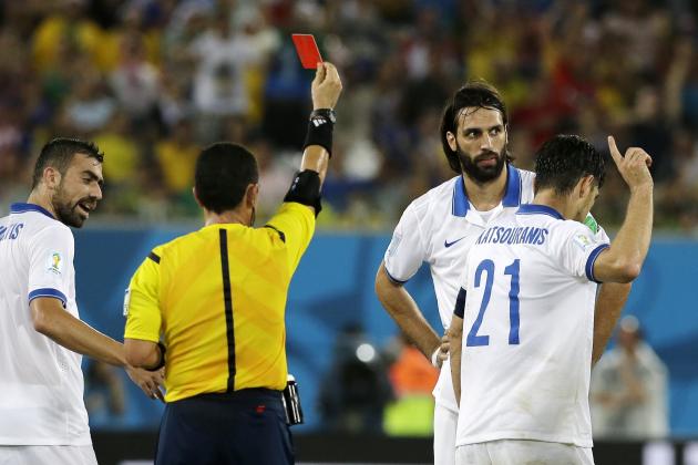 Greece's Kostas Katsouranis (21) gestures at referee Joel Aguilar from El Salvador after being sent off with a red card during the group C World Cup soccer match between Japan and Greece at the Arena das Dunas in Natal, Brazil, Thursday, June 19, 2014. (AP Photo/Shuji Kajiyama)
