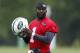 New York Jets quarterback Michael Vick looks on during an NFL football organized team activity, Wednesday, May 28, 2014, in Florham Park, N.J. (AP Photo/Julio Cortez)