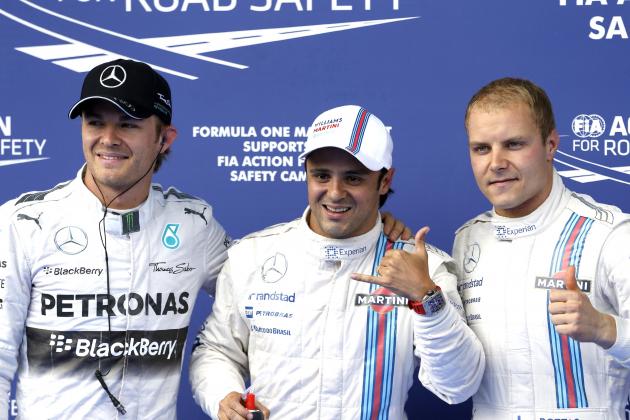 Williams driver Felipe Massa of Brazil, center, Williams driver Valtteri Bottas of Finland, right and Mercedes driver Nico Rosberg of Germany celebrate after the qualifying for Sunday's Austrian Grand Prix at the Spielberg track, Austria, Saturday, June 21, 2014.   Massa will start from the pole position ahead of Bottas and Rosberg. (AP Photo/Darko Vojinovic)