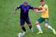 PORTO ALEGRE, BRAZIL - JUNE 18: Nigel de Jong of the Netherlands and Oliver Bozanic of Australia compete for the ball during the 2014 FIFA World Cup Brazil Group B match between Australia and Netherlands at Estadio Beira-Rio on June 18, 2014 in Porto Alegre, Brazil. (Photo by Paul Gilham/Getty Images)