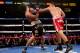 LOS ANGELES, CA - JUNE 21: Robert Guerrero (R) lands a punch on Yoshihiro Kamegai in their welterweight bout at StubHub Center on June 21, 2014 in Los Angeles, California. Guerrero won by unanimous decision. (Photo by Stephen Dunn/Getty Images)