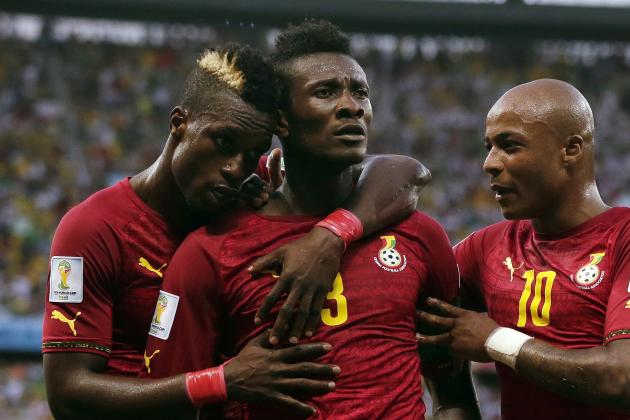Ghana's Asamoah Gyan, center, celebrates with his teammates after scoring his side's second goal during the group G World Cup soccer match between Germany and Ghana at the Arena Castelao in Fortaleza, Brazil, Saturday, June 21, 2014. (AP Photo/Marcio Jose Sanchez)