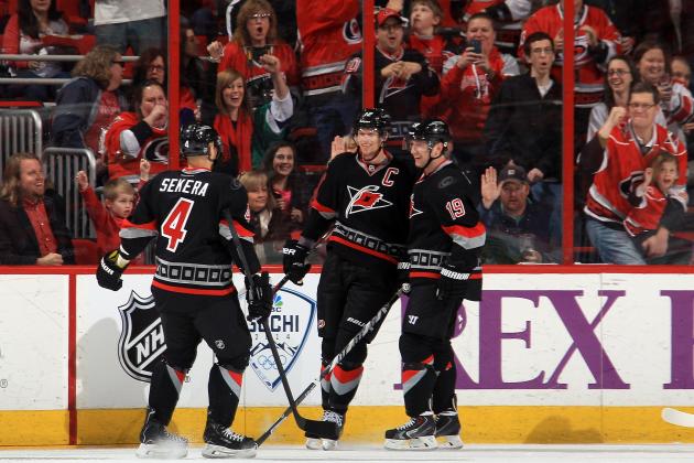 RALEIGH, NC - FEBRUARY 07: Goal scorer Jiri Tlusty #19 of the Carolina Hurricanes is congratulated by teammates Andrej Sekera #4 and Eric Staal #12 following the second-period tally against the Florida Panthers during their NHL game at PNC Arena on February 7, 2014 in Raleigh, North Carolina. (Photo by Gregg Forwerck/NHLI via Getty Images)