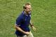 United States' head coach Juergen Klinsmann laughs after Clint Dempsey scored his side's 2nd goal during the group G World Cup soccer match between the USA and Portugal at the Arena da Amazonia in Manaus, Brazil, Sunday, June 22, 2014. (AP Photo/Themba Hadebe)