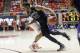 Washington's C.J. Wilcox (23) drives to the basket as Utah's Brandon Taylor, rear, defends in the second half of an NCAA college basketball game Thursday, Feb. 6, 2014, in Salt Lake City. (AP Photo/Rick Bowmer)