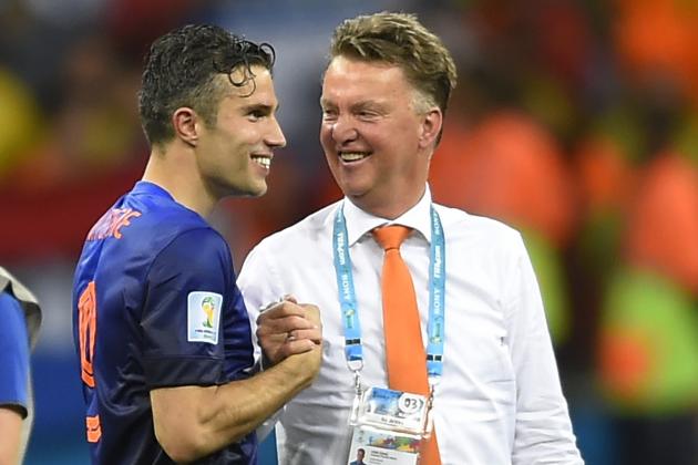 Netherlands' Robin van Persie, left, celebrates with Netherlands' head coach Louis van Gaal after the group B World Cup soccer match between Spain and the Netherlands at the Arena Ponte Nova in Salvador, Brazil, Friday, June 13, 2014. The Netherlands won the match 5-1. (AP Photo/Manu Fernandez)