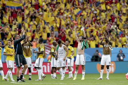 Colombian players celebrate after the group C World Cup soccer match between Colombia and Ivory Coast at the Estadio Nacional in Brasilia, Brazil, Thursday, June 19, 2014. Colombia won the match 2-1. (AP Photo/Marcio Jose Sanchez)