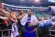Fans reach for New York Knicks' Carmelo Anthony (7) as he walks off the court following their NBA basketball game against the Utah Jazz Monday, March 31, 2014, in Salt Lake City. The Knicks won 92-83. (AP Photo/Rick Bowmer)