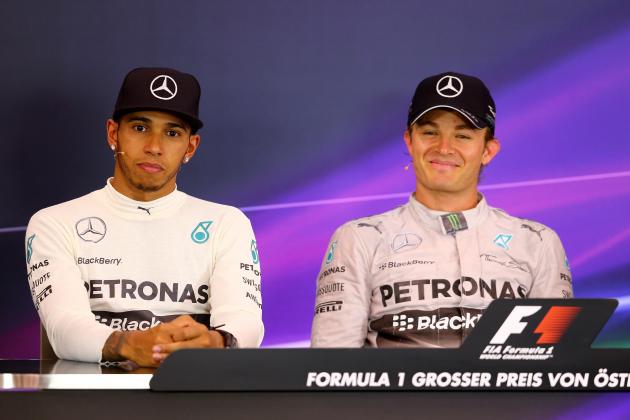 SPIELBERG, AUSTRIA - JUNE 22:  Nico Rosberg (R) of Germany and Mercedes GP smiles as he sits next to Lewis Hamilton of Great Britain and Mercedes GP in a press conference following his victory in the Austrian Formula One Grand Prix at Red Bull Ring on June 22, 2014 in Spielberg, Austria.  (Photo by Mathias Kniepeiss/Getty Images)