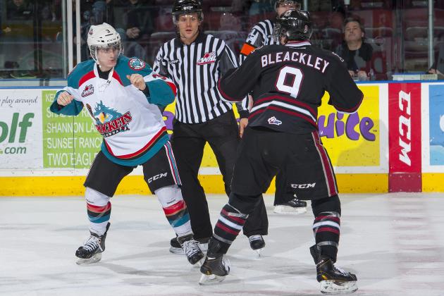 KELOWNA, CANADA -FEBRUARY 5:  Riley Stadel #3 of the Kelowna Rockets drops the gloves with Conner Bleackley C #9 of the Red Deer Rebels during the second period on February 5, 2014 at Prospera Place in Kelowna, British Columbia, Canada.   (Photo by Marissa Baecker/Getty Images)