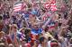 CHICAGO, IL - JUNE 22: Fans in Grant Park celebrate a goal by the U.S. against Portugal in a Group G World Cup soccer match on June 22, 2014 in Chicago, Illinois. Fans were turned away from the free event after a 10,000-person capacity was reached. (Photo by Scott Olson/Getty Images)