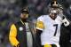 Pittsburgh Steelers head coach Mike Tomlin stands on the sideline as quarterback Ben Roethlisberger walks off the field in the second half of an NFL football game against the Baltimore Ravens, Thursday, Nov. 28, 2013, in Baltimore. (AP Photo/Gail Burton)