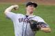 Virginia pitcher Josh Sborz pitches in the first inning of an NCAA baseball College World Series game against Virginia in Omaha, Neb., Friday, June 20, 2014. Even though the NCAA made it a banned substance 20 years ago, Sborz enjoys a pinch of chewing tobacco every now and then. (AP Photo/Nati Harnik)