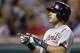 Detroit Tigers' Ian Kinsler points to the dugout after hitting a solo home run off Cleveland Indians starting pitcher Trevor Bauer in the seventh inning of a baseball game, Saturday, June 21, 2014, in Cleveland. (AP Photo/Tony Dejak)